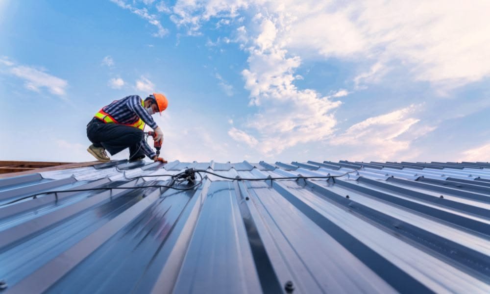 Metal roofing panel installed as an overlay over shingles